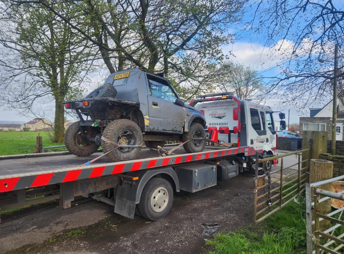 Recovery truck with an off-road vehicle